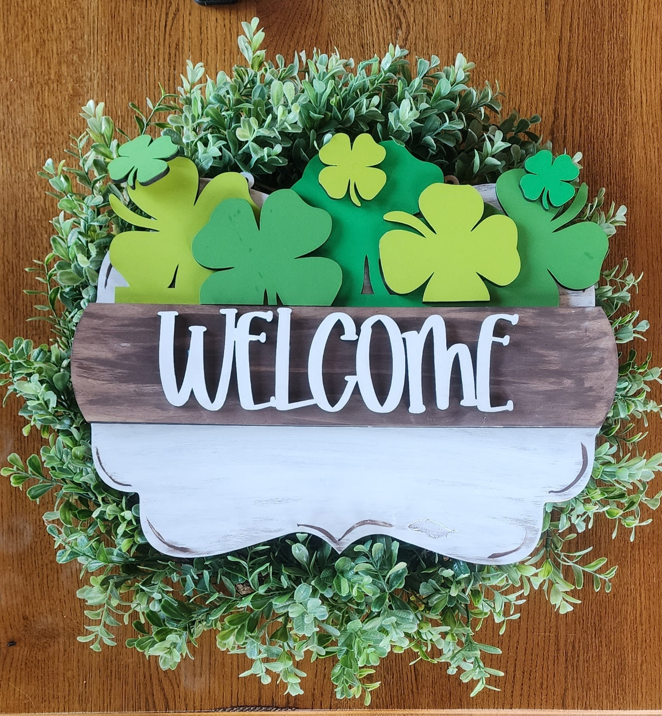 Welcome door hanger sign with a shamrock insert
